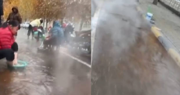 河南一村庄街上流出温泉水：市民拿着小板凳、脚盆坐在路边泡脚洗衣服 ！-第1张图片